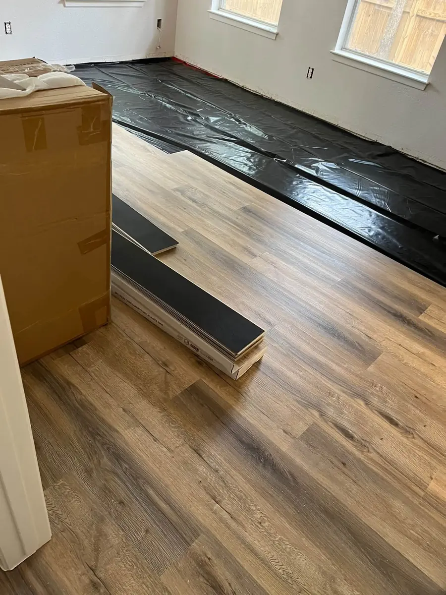 Luxury vinyl plank flooring being installed